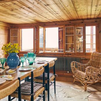 84-club-chalet-dining-area-served-table-wooden-armchair-and-two-open-windows