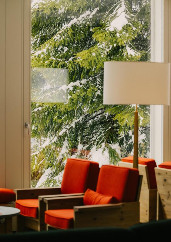 Grand Hotel Belvedere red sofa with trees covered in snow