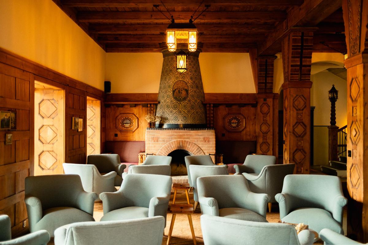 Grand Hotel Belvedere lobby with chairs and fireplace. Horizontal