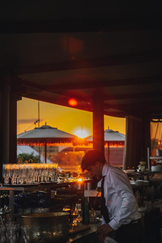 CHEZ BERNARD Restaurant golden hour waiter