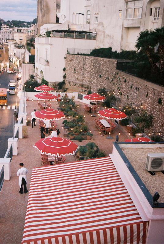 Il Capri Hotel_Terrace with umbrellas and waiter