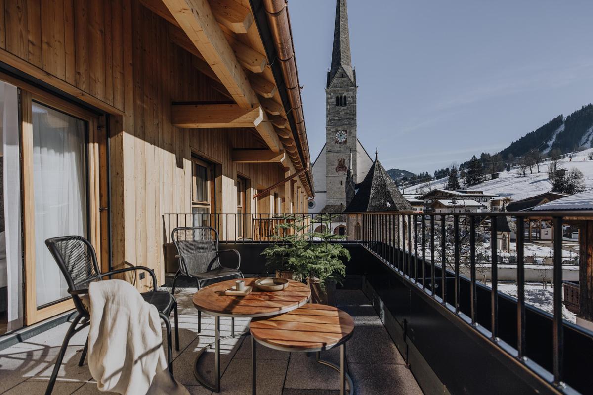 Post Maria Alm_terrace in winter months with church