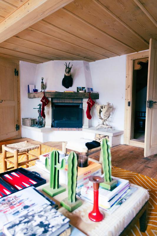 Nils Grubba_Le Chalet Saanen_salon with fireplace and cactus