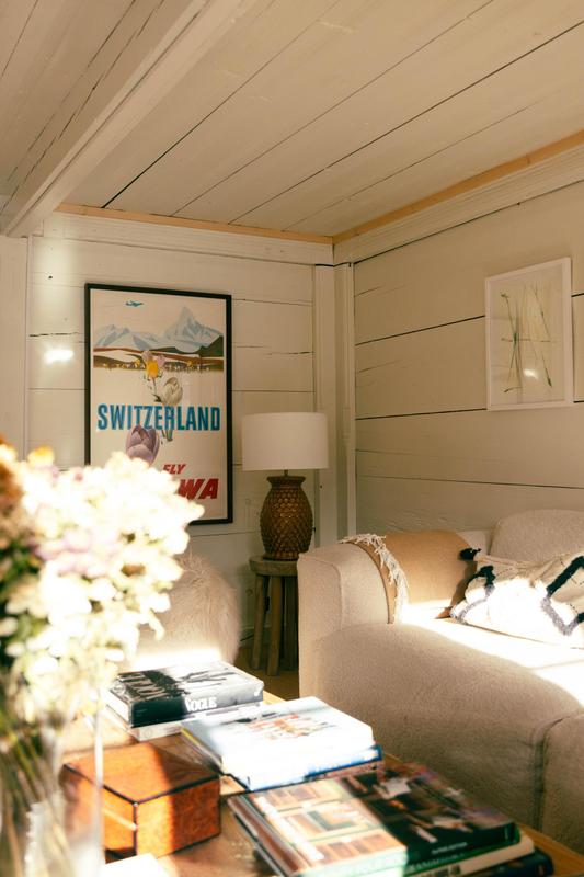 Le Chalet Lion Rouge_Nils Grubba_white salon details with flowers and poster