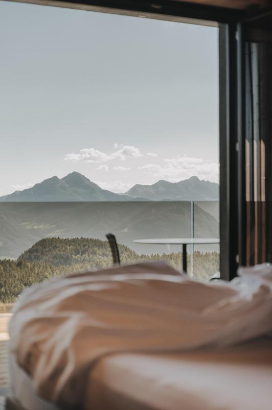Chalet Mirabell_suite with bed and views. details