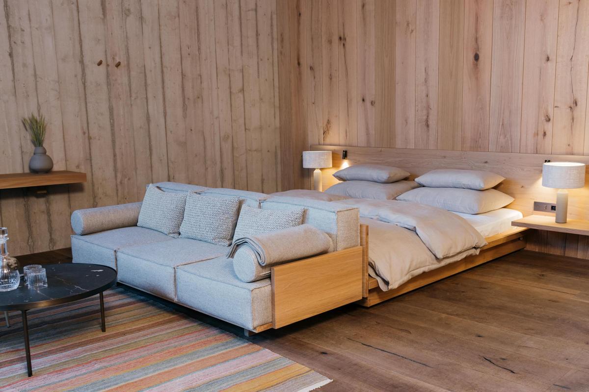 Wiesergut_Mountain Escape Suite suite with bed and sofa