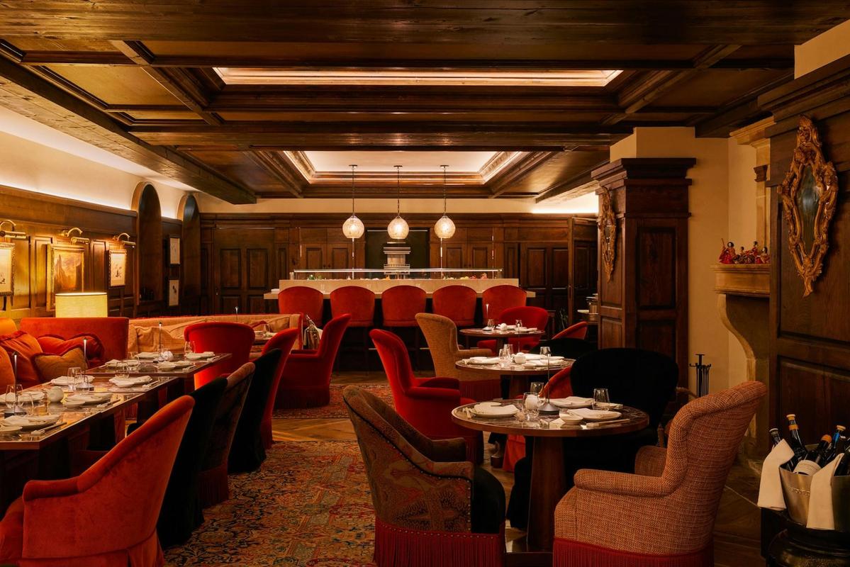 Airelles Val d'Isère bar with velvet chairs